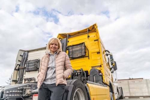 Preview: Caucasian mid age woman driving truck. trucker female worker, transport industry occupation