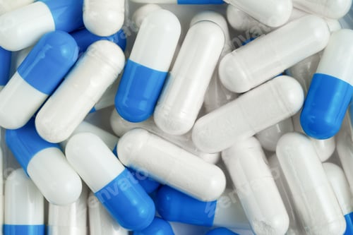 Preview: White and blue capsules background. Top view