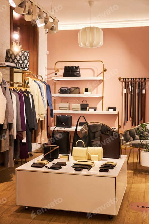Preview: Empty clothing boutique with focus on bags display