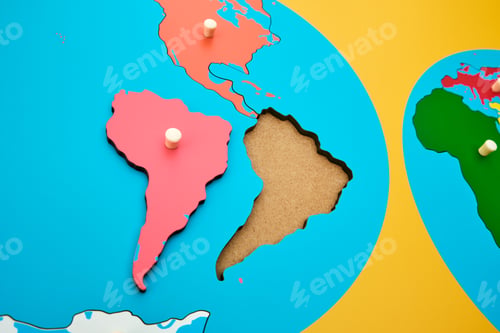 Preview: A brightly colored wooden map and globe used in a montessori school for education.