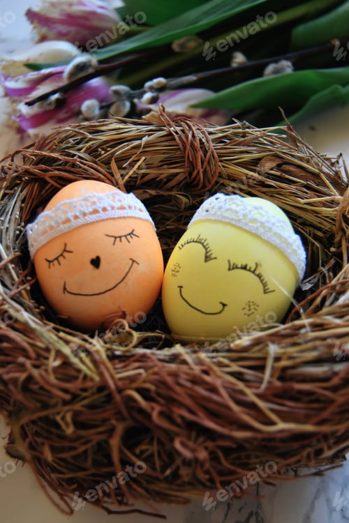 Preview: Easter themed decorated eggs in straw nest