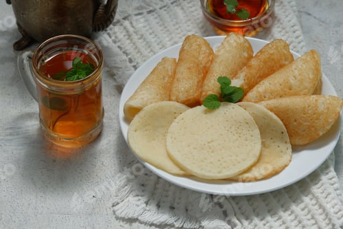 Preview: Moroccan pancakes, Arabic pancakes - Baghrir served with honey and mint tea