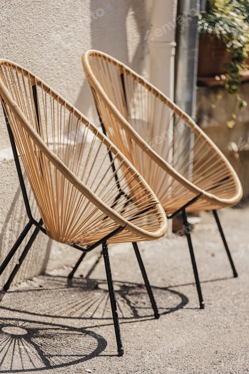 Preview: Cafe Furniture. Trendy Designer Chairs. Rattan Wicker Chair. Wicker Armchairs Stand Outside. Modern