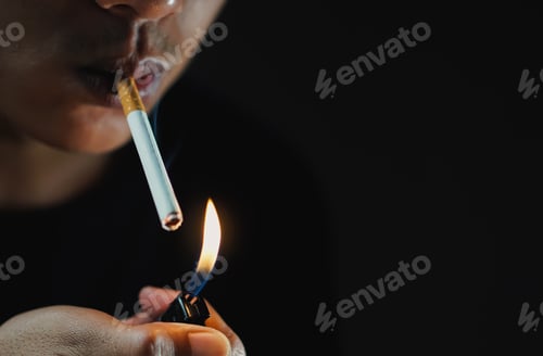 Preview: A man smoking cigarette in dark room