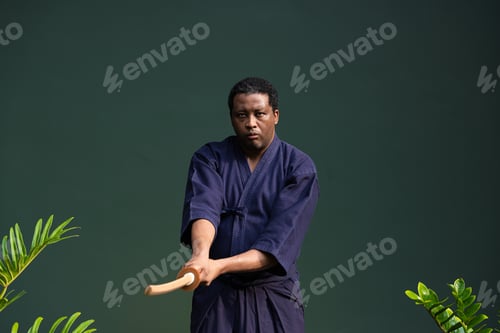 Preview: Handsome black martial artist man with martial arts costume of kendo