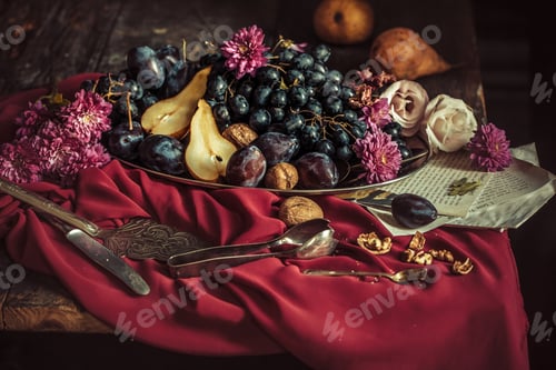 Preview: The Fruit Bowl With Grapes And Plums Against A Maroon Tablecloth