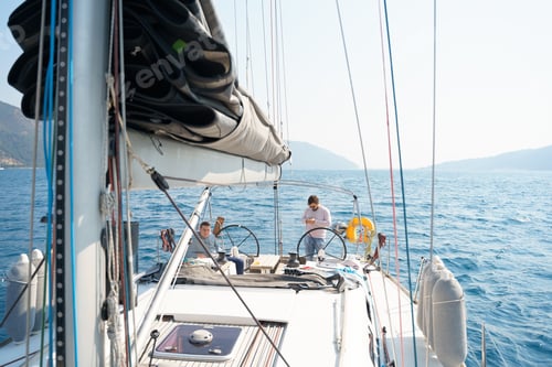 Preview: Businessman, owner with mobile phone at steering wheel in voyage sail on sport sea luxury yacht.
