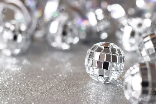 Preview: Shiny silver sparkling shimmering background with party mirror disco balls with copy space