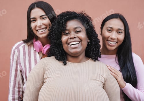 Preview: Multiracial women smiling on camera - Latin girls having fun together outdoor