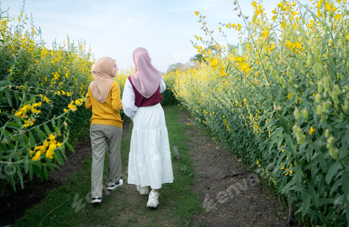 Preview: Two young Muslim women enjoying a vacation in a local park