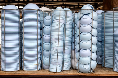 Preview: Blue bowls with cups stacked on table