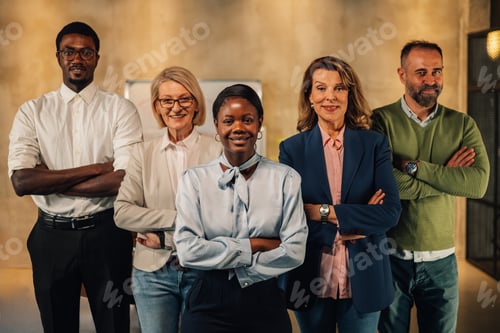 Preview: Interracial staff with arms crossed at modern office smiling at camera