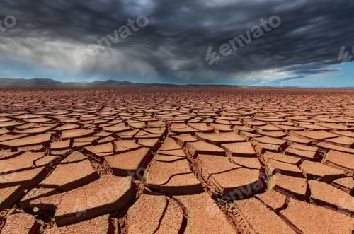 Preview: Cracked Earth in Dry Desert with Stormy Clouds