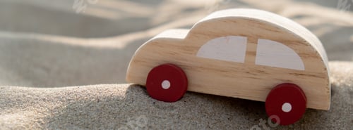 Preview: Wooden toy car on sandy beach background. Eco-friendly travel, reduce carbon footprints