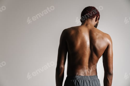 Preview: Black shirtless sportsman wearing shorts posing on camera