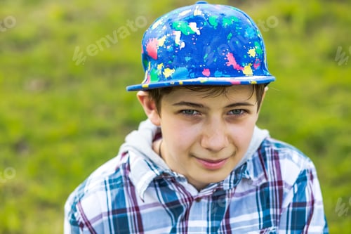 Preview: Portrait of a teenage boy in a cap