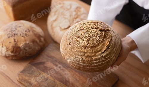 Preview: Crop hands showing bread