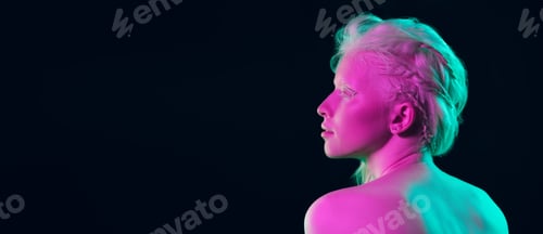 Preview: Portrait of beautiful albino girl isolated on dark studio background in neon light