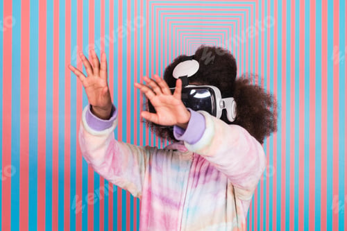 Preview: Black girl using VR goggles in studio