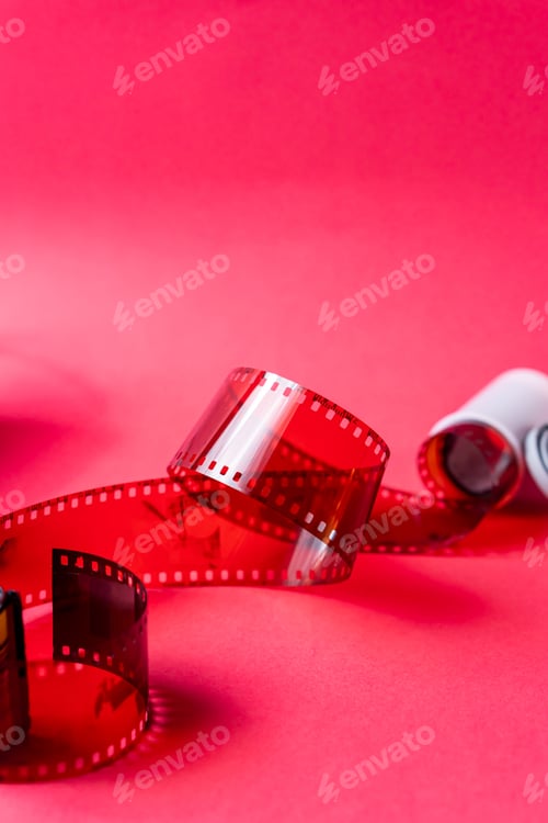 Preview: Artistic Red Film Strip on Pink Background
