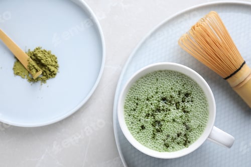 Preview: Flat lay composition with tasty matcha green tea latte on light grey marble table