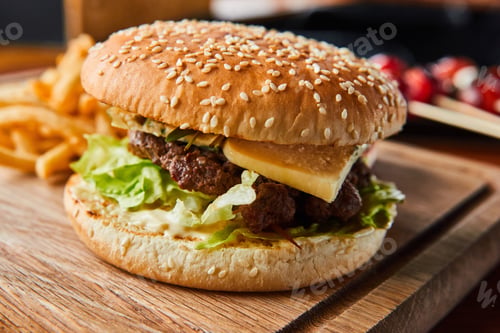 Preview: fast food delivery home. mouth-watering, delicious burger used chop beef on wooden table