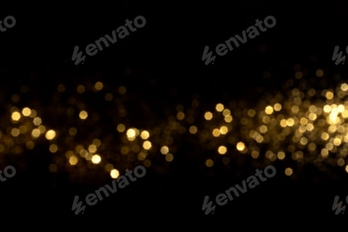 Preview: Golden blurred bokeh lights on black background
