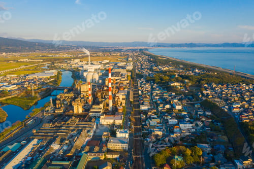 Preview: Petrochemical oil refinery and sea in industrial engineering, urban city. Oil and gas tanks
