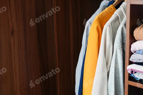 Preview: Neat Closet with Shirts and Stacked Clothes