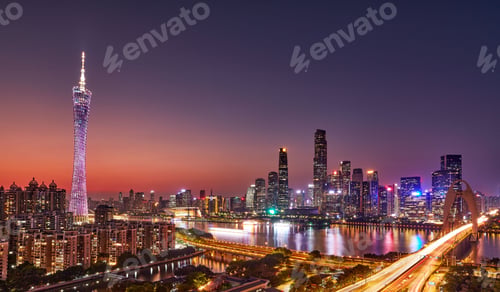 Preview: a cityscape that has cars and buildings lit up at night