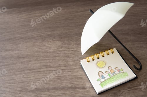 Preview: A child's drawing of a family under an umbrella with copy space.