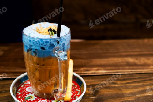 Preview: Thailand Ice Tea Mixed With Milk Blue On A Dark Background.