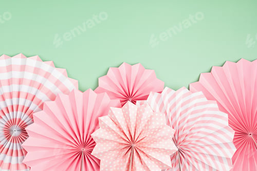 Preview: Festive party background with pink paper circle fans over pastel background. Festival, birthday