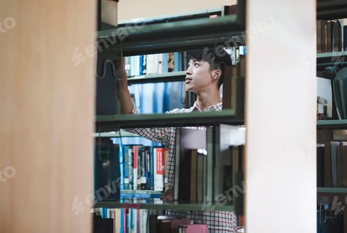 Preview: Man Searching for a Book in the Library