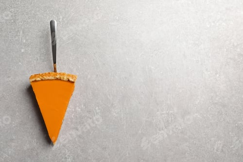 Preview: Piece of fresh delicious homemade pumpkin pie on gray background, top view with space for text