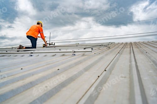 Preview: A skilled technician adjusts a solar panel on rooftop