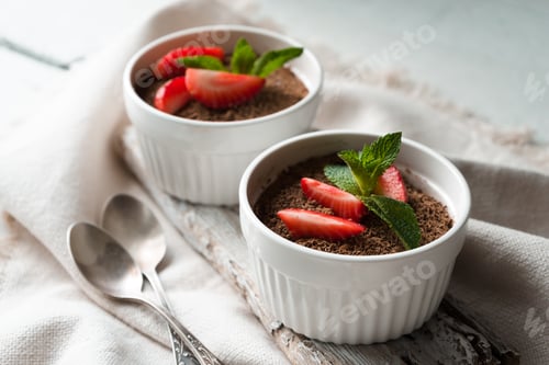Preview: Tiramisu in the ramekins on the white table horizontal