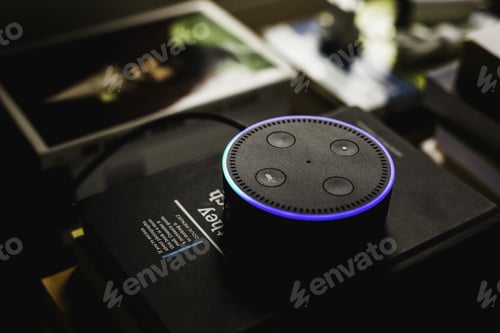 Preview: Closeup shot of a round black small audio control device on books indoors