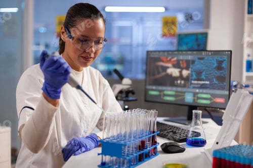 Preview: Medical chemist doing research and tests on blood tubes