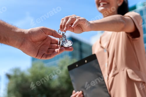 Preview: oyful Unrecognizable Businesswoman, Real Estate Employee, Handing Keys to Delighted Homebuyer
