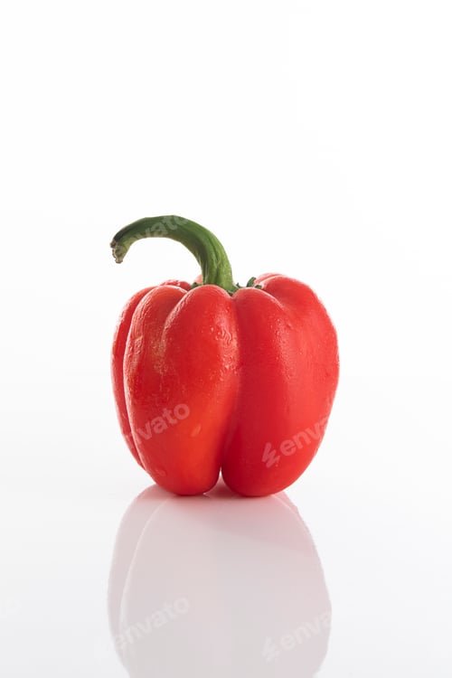 Preview: Red bell pepper on a white surface