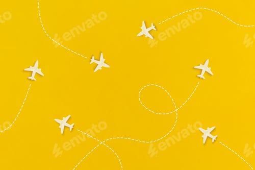 Preview: Airplanes on a yellow background. Top view. Flat lay.