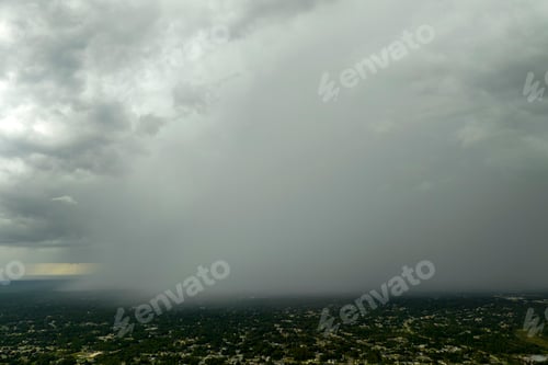Preview: Landscape of dark ominous clouds forming on stormy sky during heavy thunderstorm