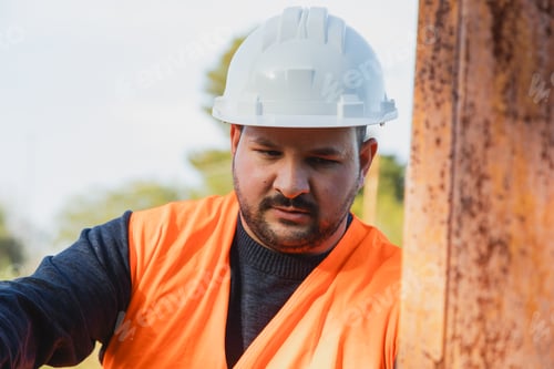 Preview: Worker Measuring The Place For The Next Building