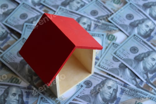 Preview: House on top of pile of money.