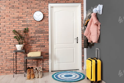 Preview: Modern hallway interior with stylish furniture, suitcase and clothes on wall