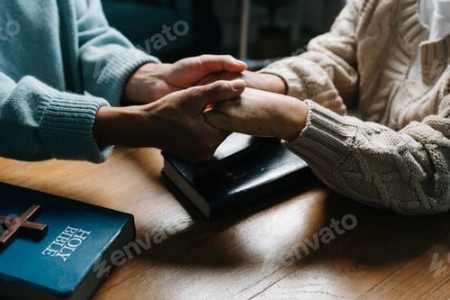 Preview: Men and women praying to God with the Bible.