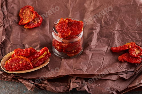Preview: Fermented vegetarian canned food concept. Pickled dried tomatoes in a glass jar.