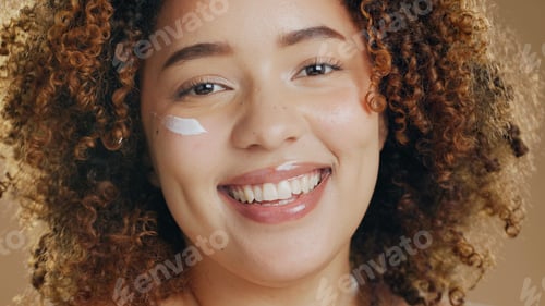 Preview: Face cream, skincare and black woman in studio for cosmetology, treatment and wellness on brown bac