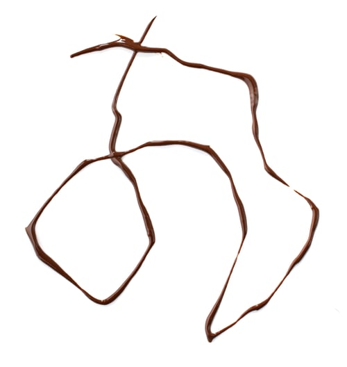 Preview: melted chocolate on white background